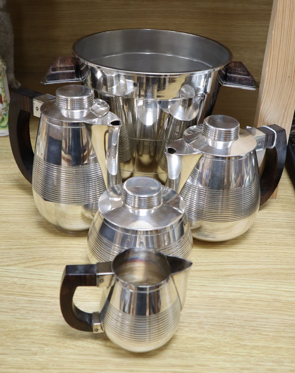 A French silver plate four piece teaset, and a near matching ice bucket, height 19cm